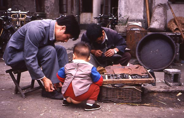 child with bare butt shoemaker cobbler