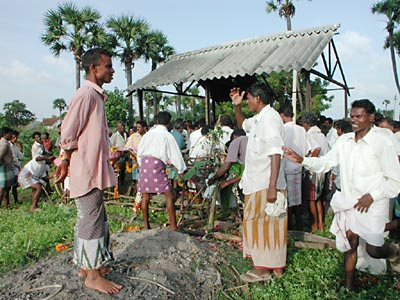 man standing in the ash,funeral,india,cremation