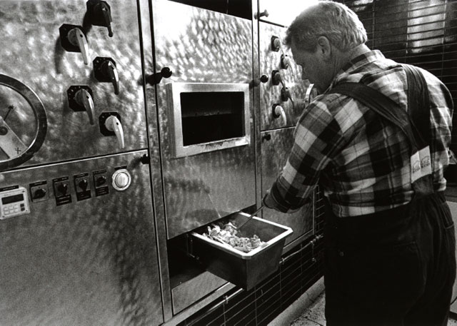 crematoria worker finding the identification plate in the cremated ashes