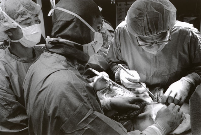 Three surgeons at the dead body