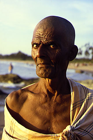 old man wrinkles intense eyes stiff look wonderful sun set warm light