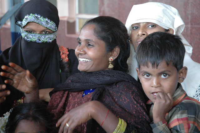 happy muslim women laughing