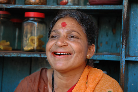 indian woman selling beetel nut kawala red dot in the forehead