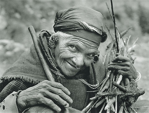 wrinkly woman with great eyes and a happy face India Manali