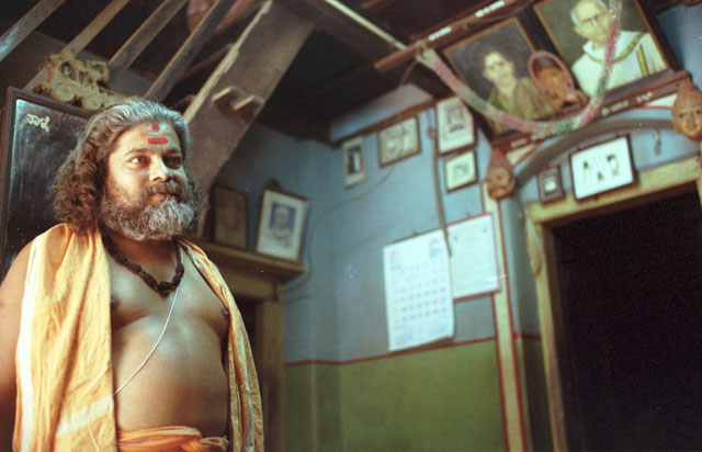 sadhu, a holy man in india with beard and a nice shiny belly stomach