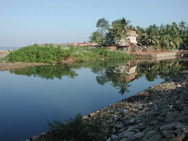 the blue water is actually part of the sewage system of the Gokarna, it is alos used as a latrin by many pilgrims, but it looks beautiful though