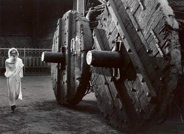 Ghost like sadhu next to huge wheels of the chariot Ratha 300 to 400 year old wooden chariot used during the Shiva ratri festival