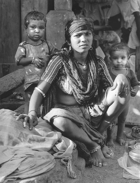 woman with kids and a wild look street vendor