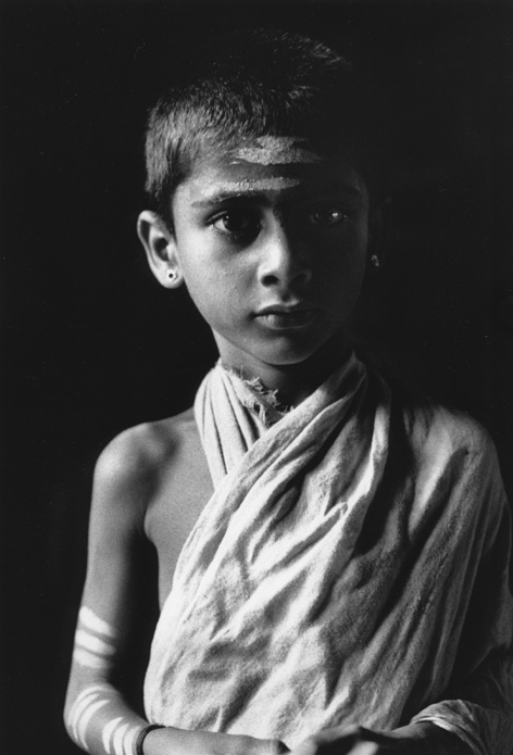 Brahmin boy posing in side light in Shiva temple Gokarna