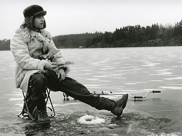 ice fishing on a frozen lake Sweden