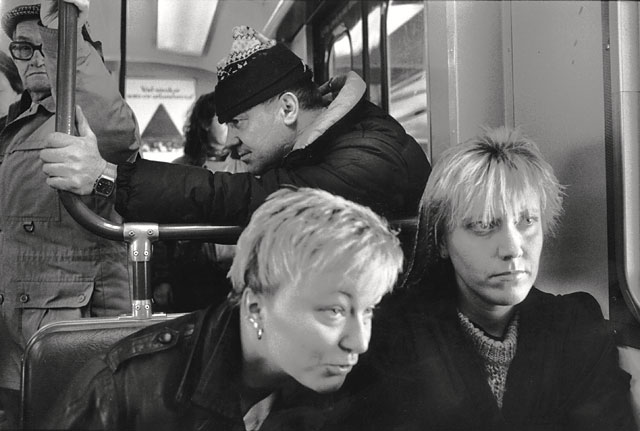 Stockholm subway, two young women staring towards right, a man staring to the left ready to run, one man staring at the photographer