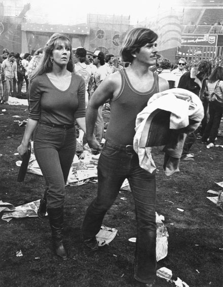 man and woman holding hands during Rolling Stones consert San Francisco 1982
