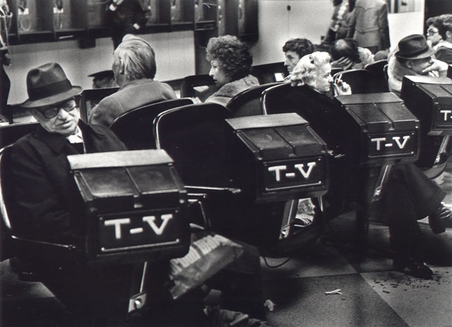 sleeping man in waiting room with tv