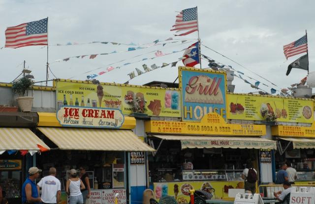 american flags on the roof of Coney Island stands for ice cream grill sausage