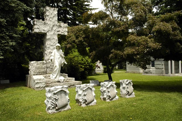 woodlawn cemetery, large cross with angel and four tomb stones