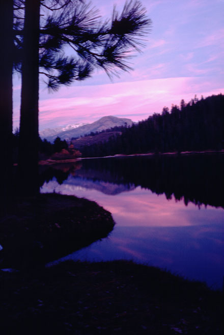 hume lake sunset mountain reflects in clear lake