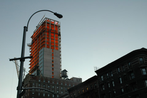 new sky scraper glowing in evening sunset light new york