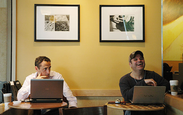 computers lap top two men laughing