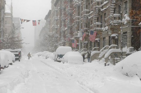 Snow in New york Manhattan American and Puerto Rica flags