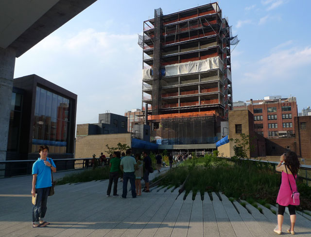 A man in blue and a woman in red standing on High Line