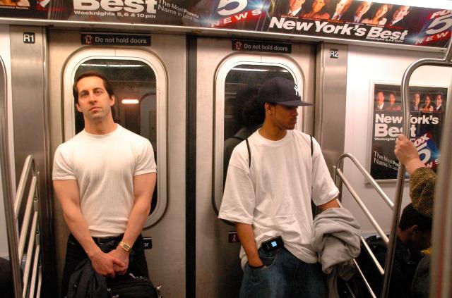 Two men in white, New York subway. MTA