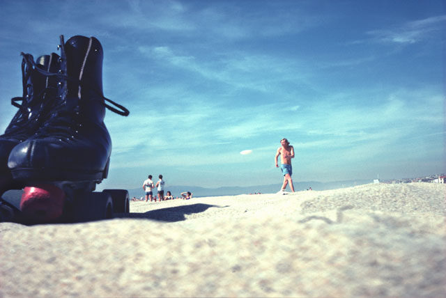 Huge rolleskates on sand Venice beach fresbee